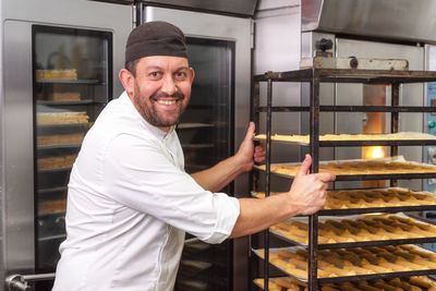 Portrait of smiling man standing in store