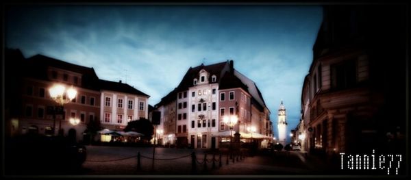 Buildings in city at night