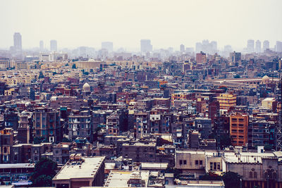 Scenic view of town against clear sky