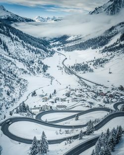 Scenic view of snow covered mountains against sky