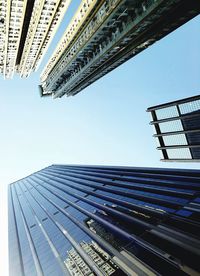 Low angle view of modern buildings against clear sky