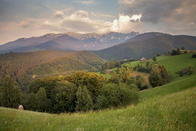 Scenic view of landscape and mountains against sky