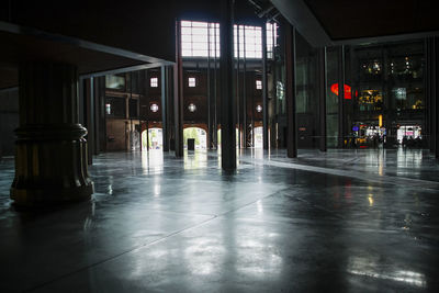 Empty corridor in building at night