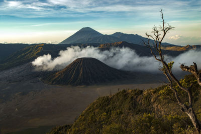 Smoke emitting from volcanic mountain