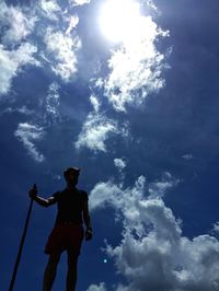 Low angle view of people against sky