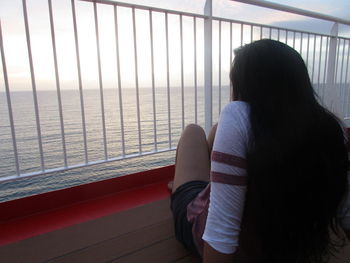 Rear view of woman looking at sea