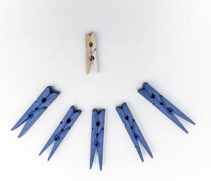 High angle view of clothespins on white background