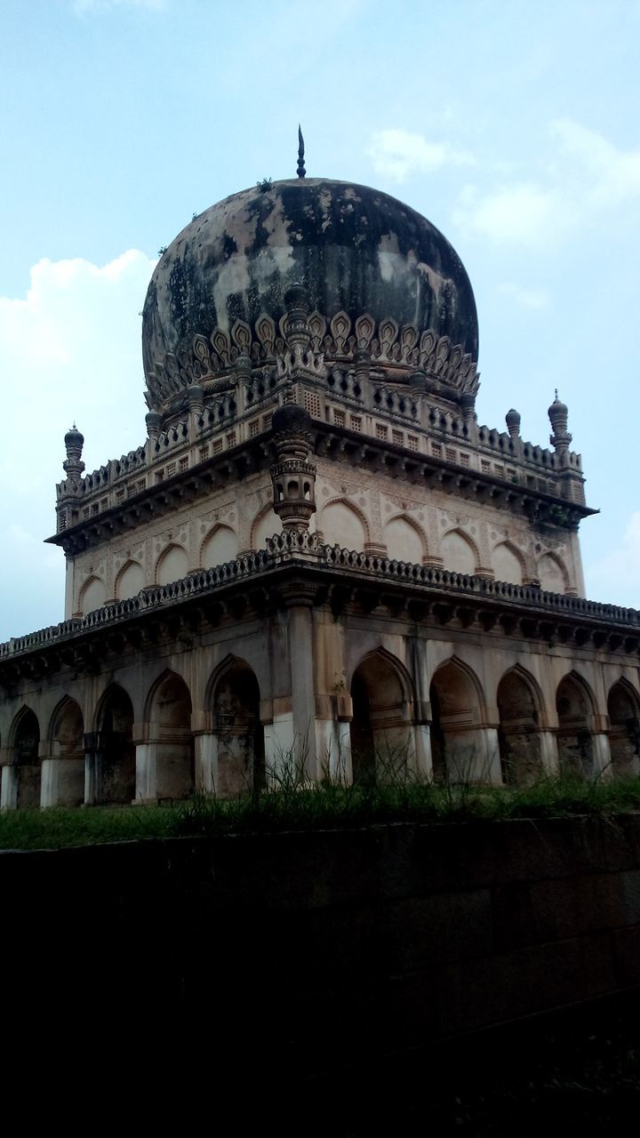 architecture, built structure, building exterior, arch, sky, low angle view, facade, dome, history, travel destinations, place of worship, religion, famous place, architectural column, grass, day, outdoors, spirituality, cloud - sky, travel