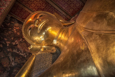 Low angle view of statue of buddha against building