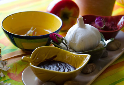 Close-up of garlic with sauces on table