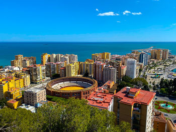 High angle view of modern buildings in city against sky