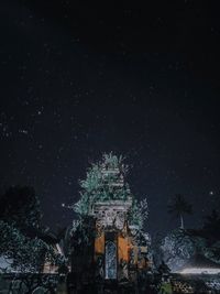 Low angle view of old building against sky at night