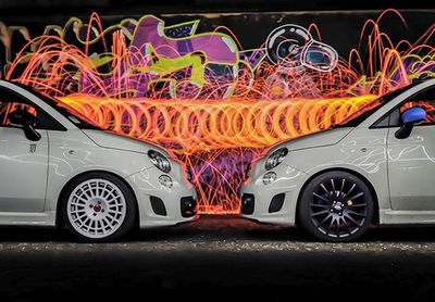 Cars parked on road at night