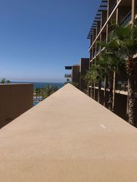 Scenic view of beach against clear blue sky