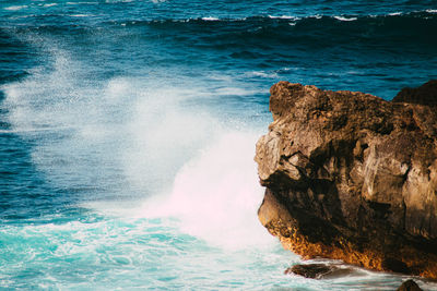 Aerial view of rock formation on sea shore