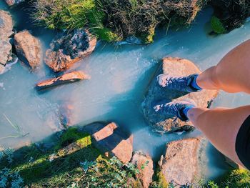 Low section of woman on rock