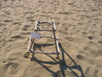 High angle view of slide on sand at playground