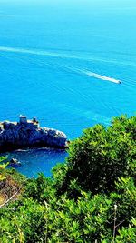 Scenic view of sea against blue sky