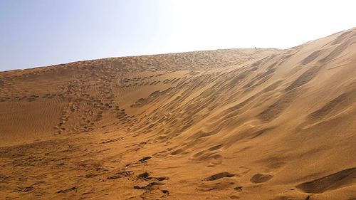 Scenic view of desert against clear sky