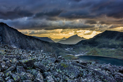 Scenic view of mountains against dramatic sky