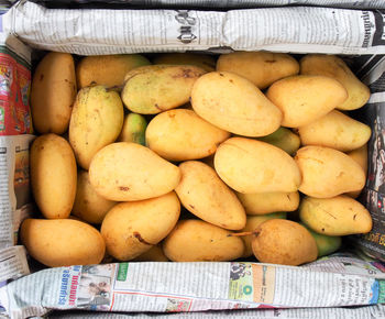 Close-up of mangoes in container