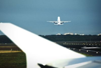 Airplane wing in sky