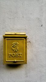 Close-up of yellow mailbox