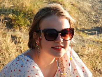 Portrait of young woman wearing sunglasses