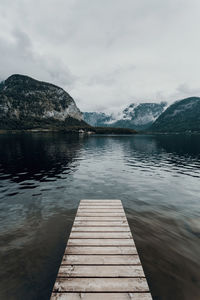 Pier over lake against sky