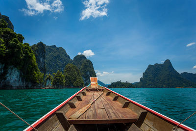 Scenic view of sea and mountains against sky