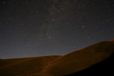 Low angle view of star field against sky at night
