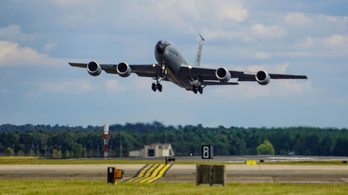 Airplane flying against sky