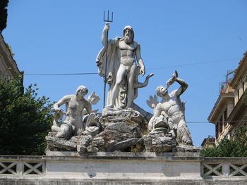 Low angle view of statue against sky