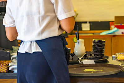 Midsection of man working in workshop