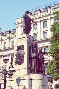 Low angle view of statue in city