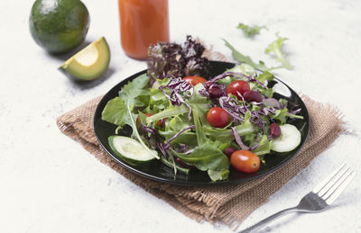 High angle view of fruits in plate on table