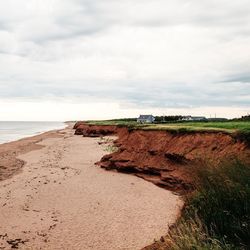 Scenic view of sea against cloudy sky