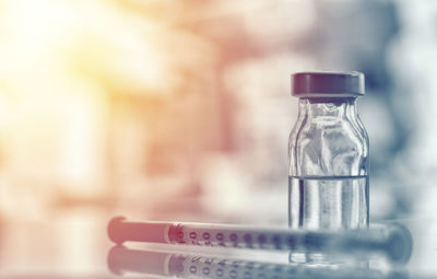 Close-up of glass bottle on table