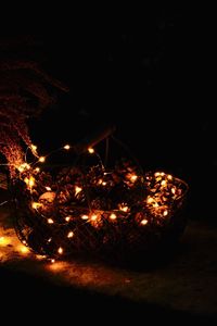 Illuminated fire on field at night