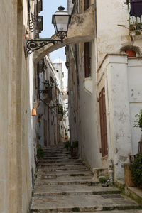 Empty alley amidst buildings in town