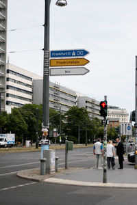 People crossing road in city