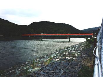 Bridge over river against sky