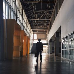 Full length of woman walking in corridor