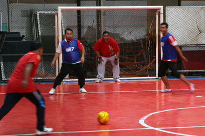 Full length of a man playing with ball