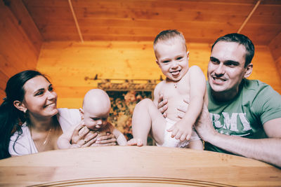 Father and son on table