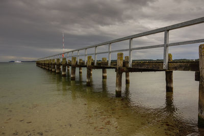 Pier over sea against sky