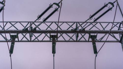 Low angle view of crane against sky