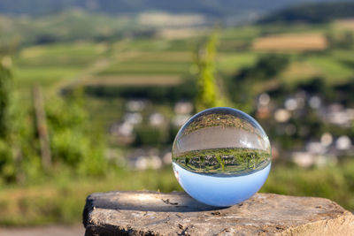 Close-up of crystal ball on field