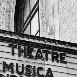 Low angle view of text on building