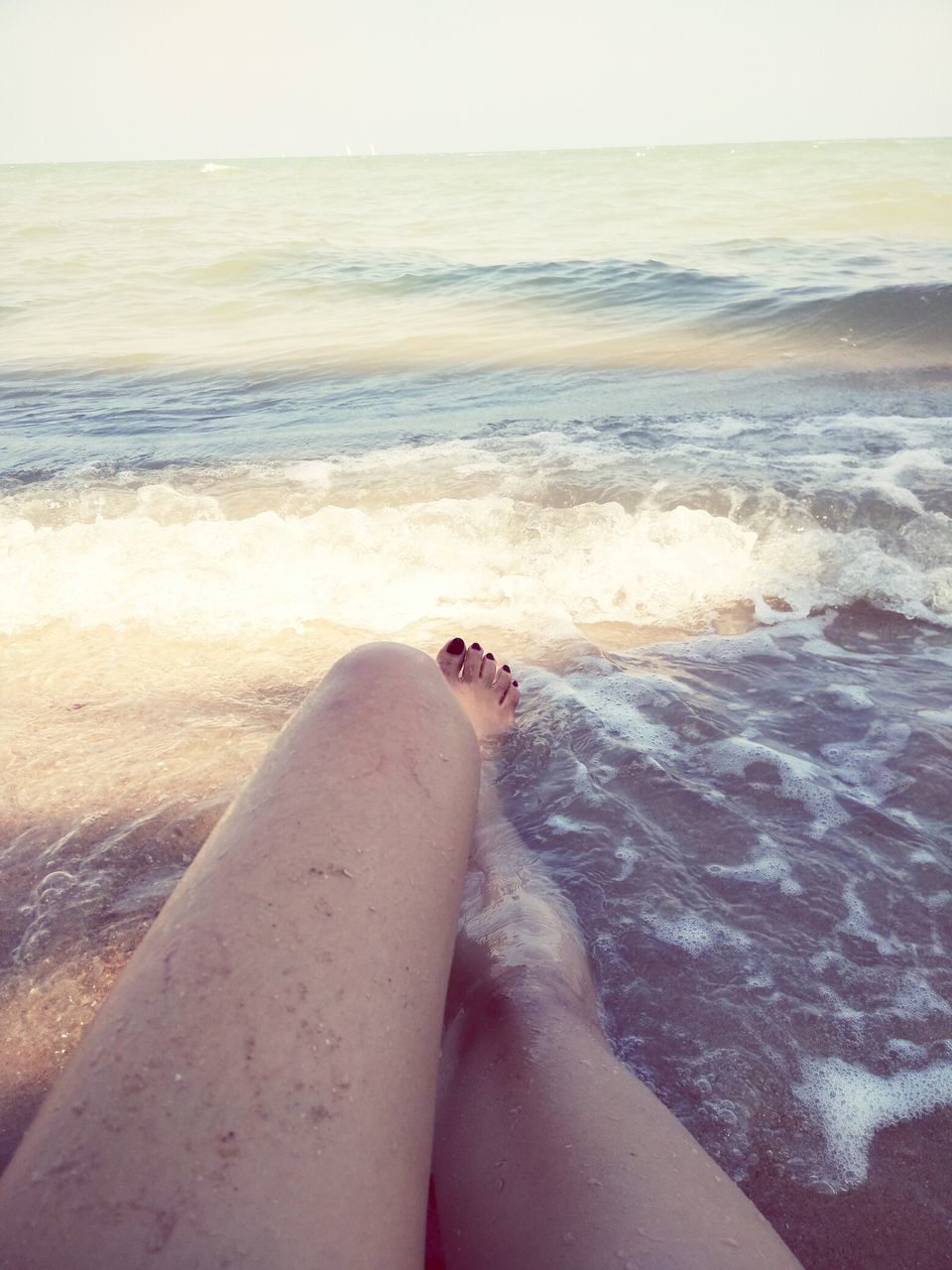 sea, water, person, low section, beach, personal perspective, horizon over water, barefoot, shore, sand, human foot, lifestyles, wave, leisure activity, surf, vacations, relaxation